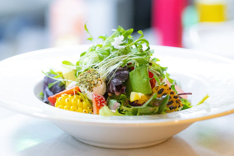 Garden salad with colorful fresh vegetables at dions