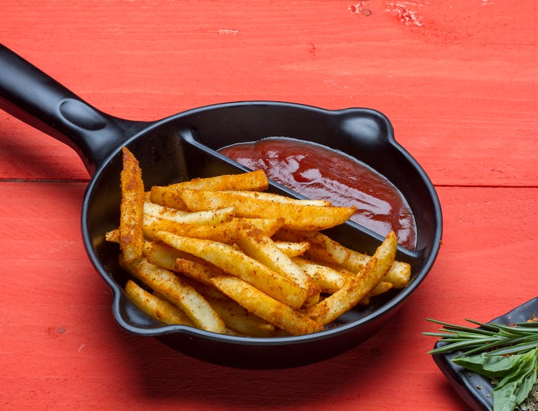 Crispy seasoned breadsticks side dish at Dions